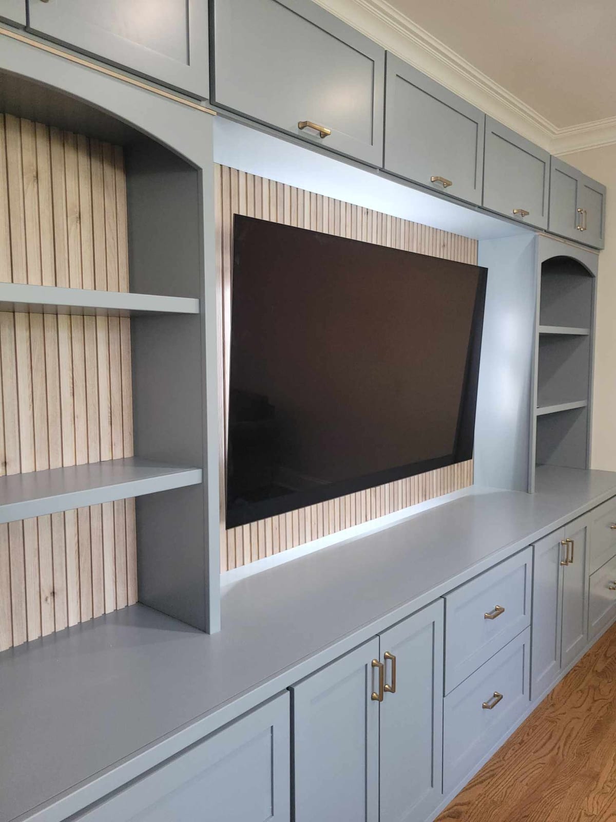 Custom built-in entertainment center with fluted side panels