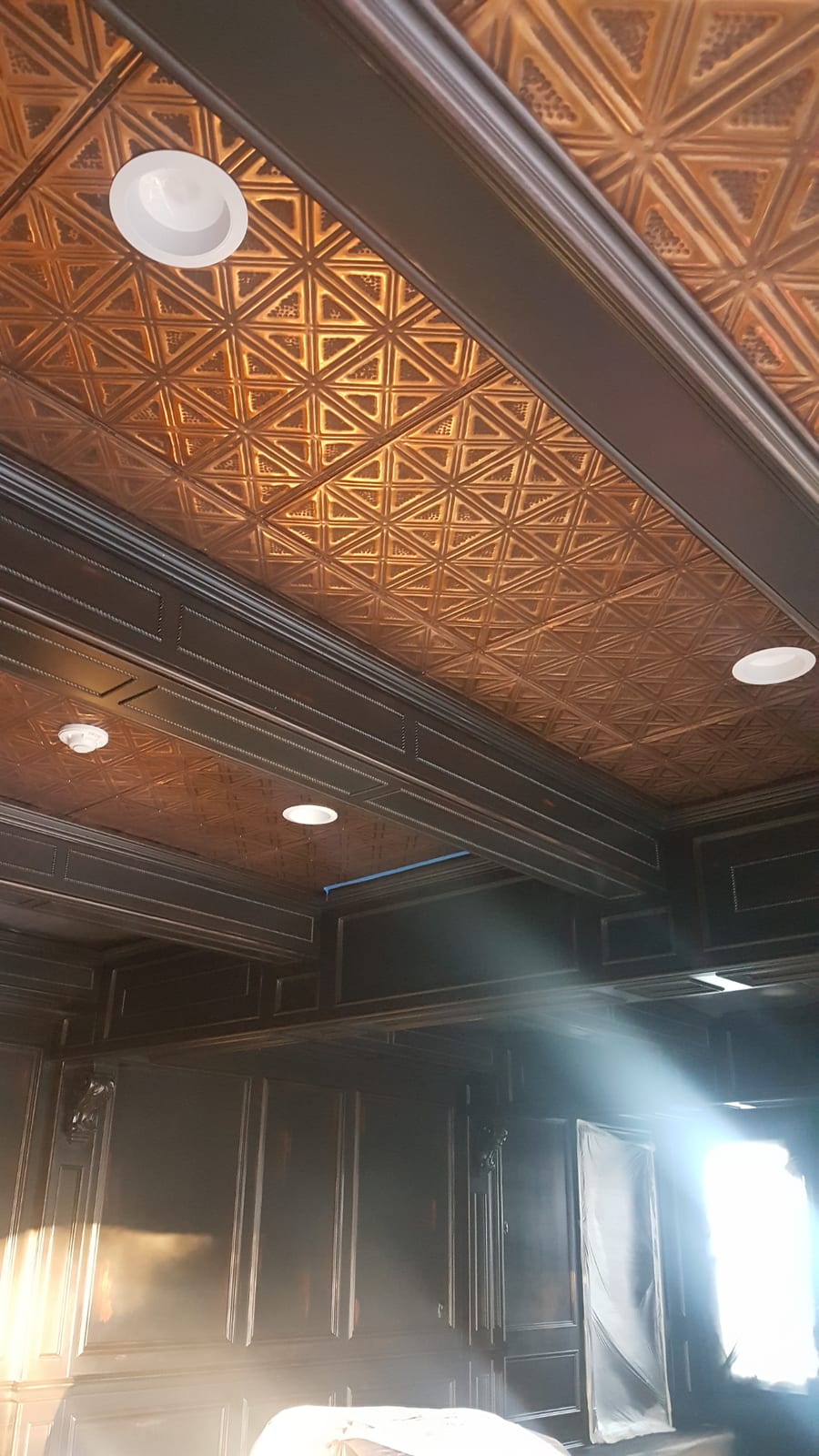 Decorative copper-finish ceiling with crown molding by Eco-Deco